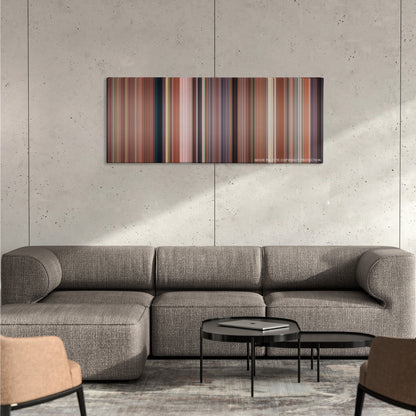 Bridesmaids color palette canvas on a concrete wall above a gray sectional sofa
