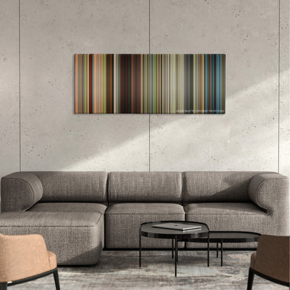 Mr. Right color palette canvas on a concrete wall above a gray sectional sofa