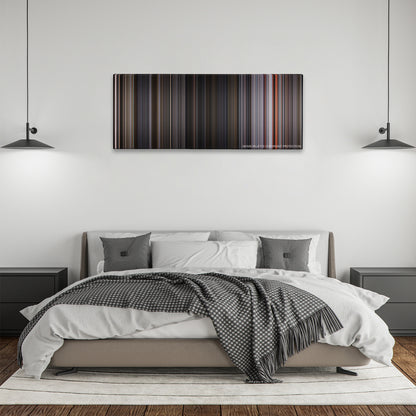 Ant-Man and the Wasp color palette canvas above a bed, between two black pendant lamps