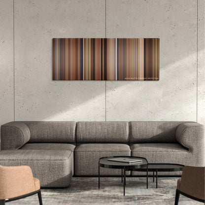 Under the Tuscan Sun color palette canvas on a concrete wall above a gray sectional sofa