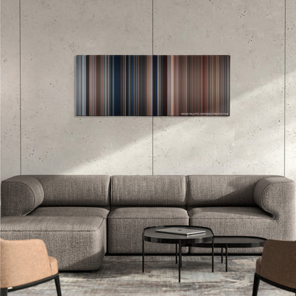 National Lampoon's Christmas Vacation color palette canvas on a concrete wall above a gray sectional sofa