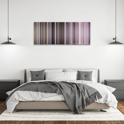 Miracle color palette canvas above a bed, between two black pendant lamps
