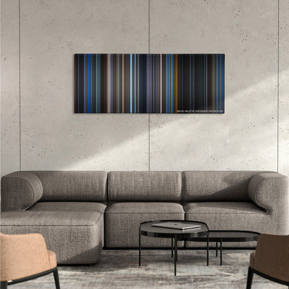 Unbreakable color palette canvas on a concrete wall above a gray sectional sofa