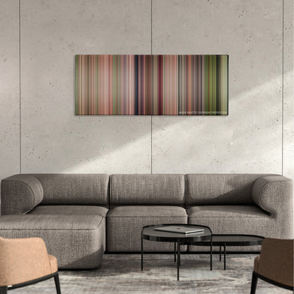 Steel Magnolias color palette canvas on a concrete wall above a gray sectional sofa