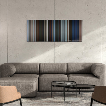 Pirates of the Caribbean: The Curse of the Black Pearl color palette canvas on a concrete wall above a gray sectional sofa