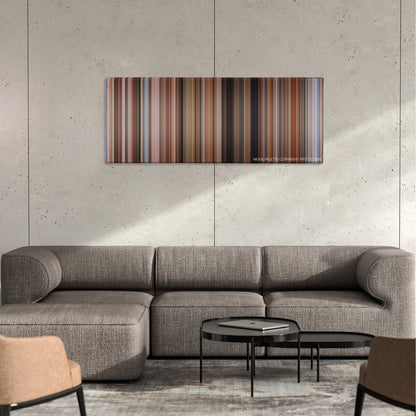 Overboard color palette canvas on a concrete wall above a gray sectional sofa