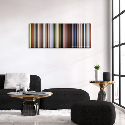 Up color palette canvas above a black sofa with a gold-topped table