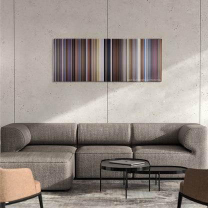 Raising Arizona color palette canvas on a concrete wall above a gray sectional sofa