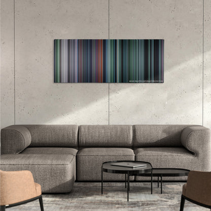 The Hunger Games color palette canvas on a concrete wall above a gray sectional sofa