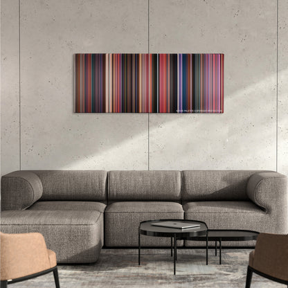 Incredibles 2 color palette canvas on a concrete wall above a gray sectional sofa