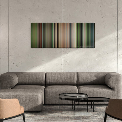 Apocalypto color palette canvas on a concrete wall above a gray sectional sofa