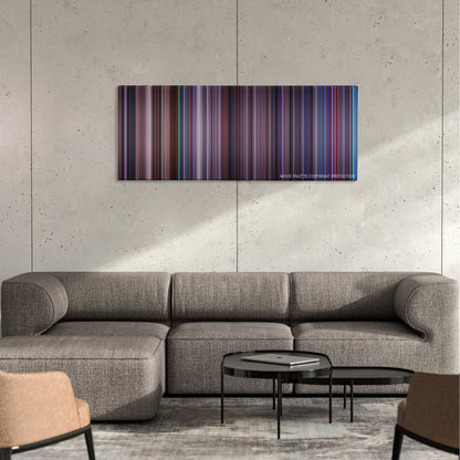 Hackers color palette canvas on a concrete wall above a gray sectional sofa