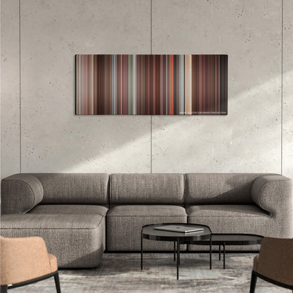 Meet Joe Black color palette canvas on a concrete wall above a gray sectional sofa