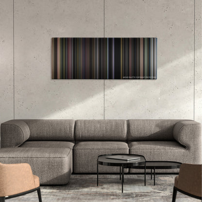 American Graffiti color palette canvas on a concrete wall above a gray sectional sofa