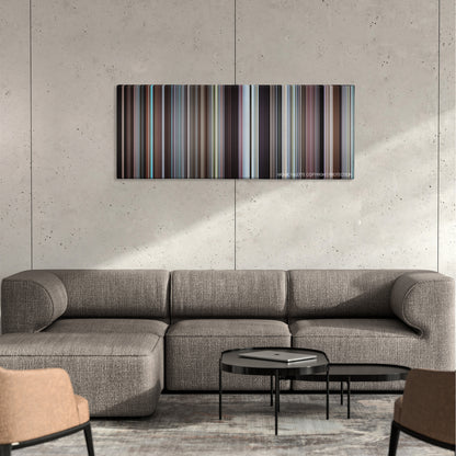 Harold and Maude color palette canvas on a concrete wall above a gray sectional sofa