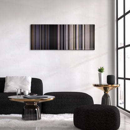 Transcendence color palette canvas above a black sofa with a gold-topped table