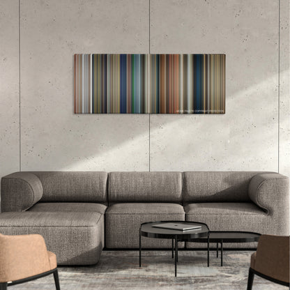 Days of Thunder color palette canvas on a concrete wall above a gray sectional sofa