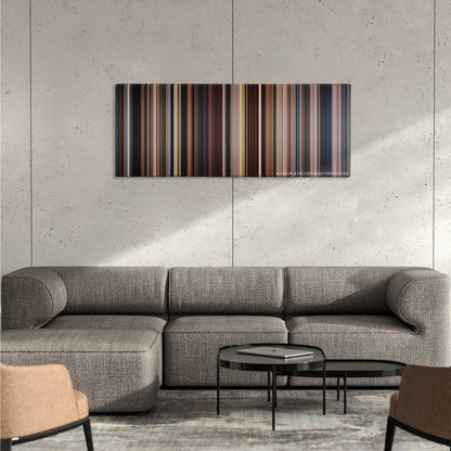 Big Fish color palette canvas on a concrete wall above a gray sectional sofa