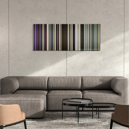 Hustlers color palette canvas on a concrete wall above a gray sectional sofa