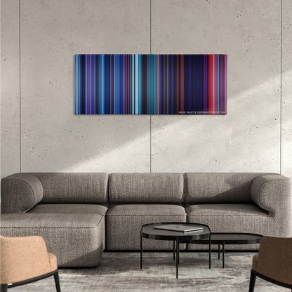 Pocahontas color palette canvas on a concrete wall above a gray sectional sofa