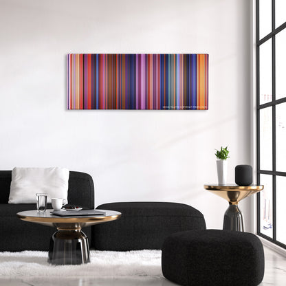 Coco color palette canvas above a black sofa with a gold-topped table