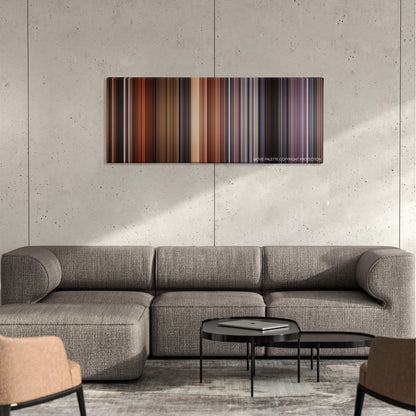Time Bandits color palette canvas on a concrete wall above a gray sectional sofa