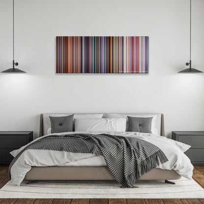 Akira color palette canvas above a bed, between two black pendant lamps