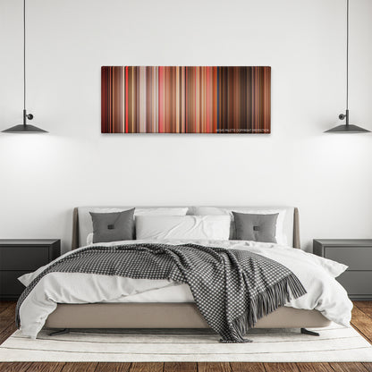 Do the Right Thing color palette canvas above a bed, between two black pendant lamps