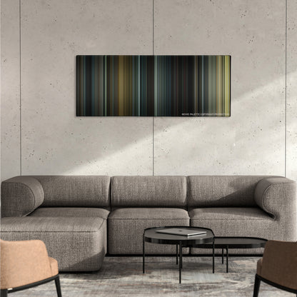 Se7en color palette canvas on a concrete wall above a gray sectional sofa