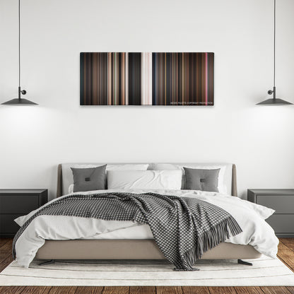Little Shop of Horrors color palette canvas above a bed, between two black pendant lamps