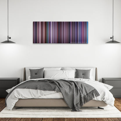 Hackers color palette canvas above a bed, between two black pendant lamps