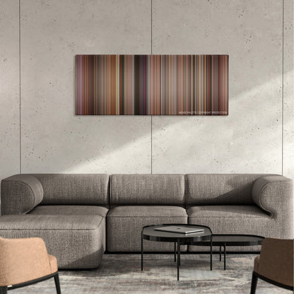 Sister Act color palette canvas on a concrete wall above a gray sectional sofa