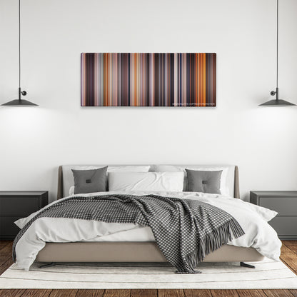 Backdraft color palette canvas above a bed, between two black pendant lamps