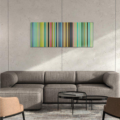 Ponyo color palette canvas on a concrete wall above a gray sectional sofa
