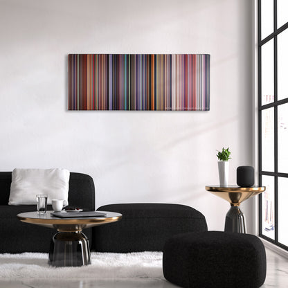 Akira color palette canvas above a black sofa with a gold-topped table