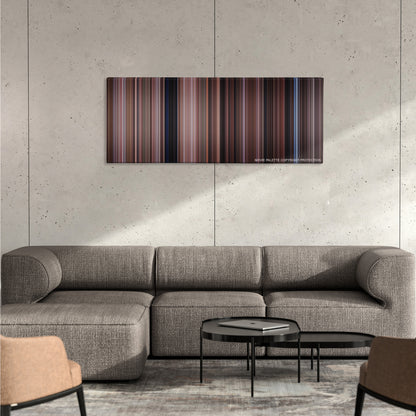 Dead Poets Society color palette canvas on a concrete wall above a gray sectional sofa