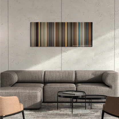 Legend color palette canvas on a concrete wall above a gray sectional sofa