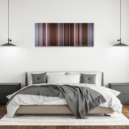 Derailed color palette canvas above a bed, between two black pendant lamps