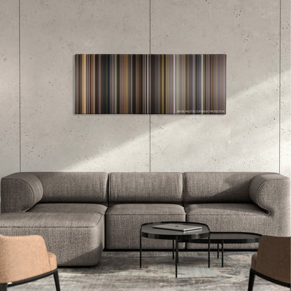 Rudy color palette canvas on a concrete wall above a gray sectional sofa