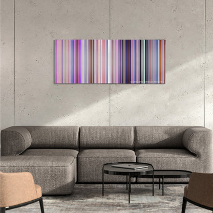 Inside Out color palette canvas on a concrete wall above a gray sectional sofa