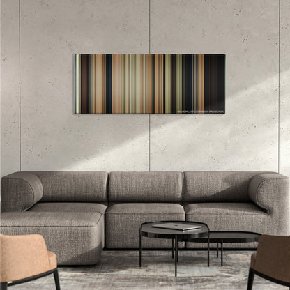 The Sound of Music color palette canvas on a concrete wall above a gray sectional sofa