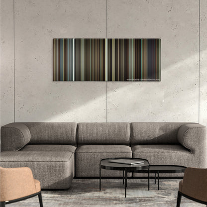 Flight color palette canvas on a concrete wall above a gray sectional sofa