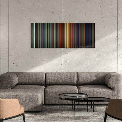 Ad Astra color palette canvas on a concrete wall above a gray sectional sofa