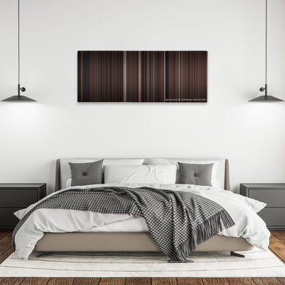 Clue color palette canvas above a bed, between two black pendant lamps