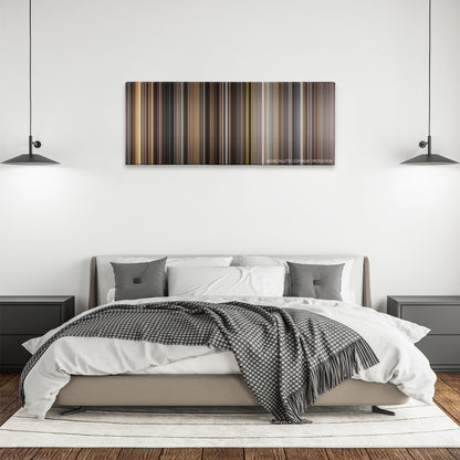 Rudy color palette canvas above a bed, between two black pendant lamps
