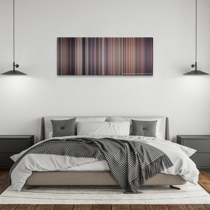 The Fugitive color palette canvas above a bed, between two black pendant lamps