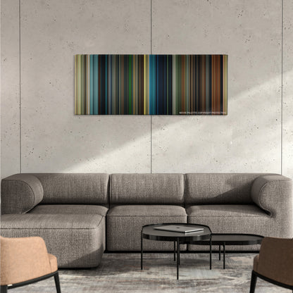 Maleficent color palette canvas on a concrete wall above a gray sectional sofa