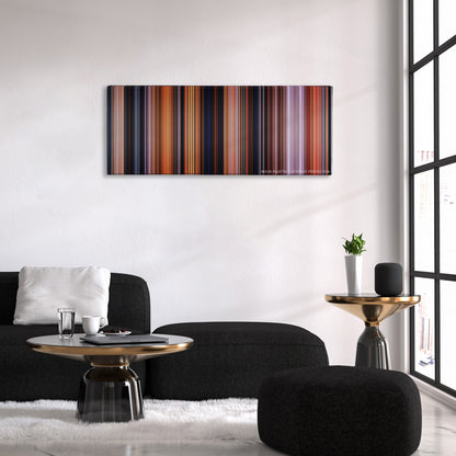 The Iron Giant color palette canvas above a black sofa with a gold-topped table