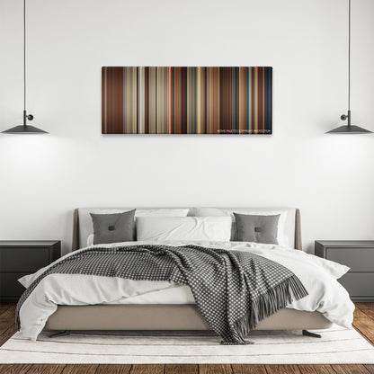 Going the Distance color palette canvas above a bed, between two black pendant lamps
