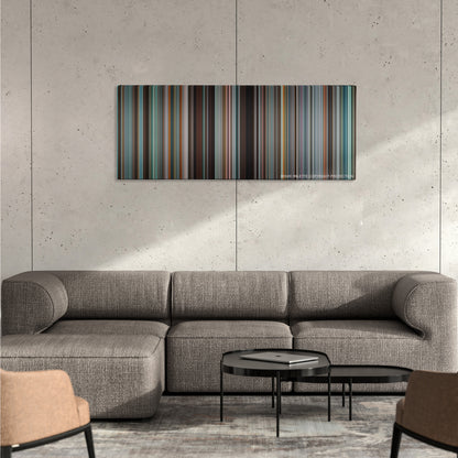 Tower Heist color palette canvas on a concrete wall above a gray sectional sofa